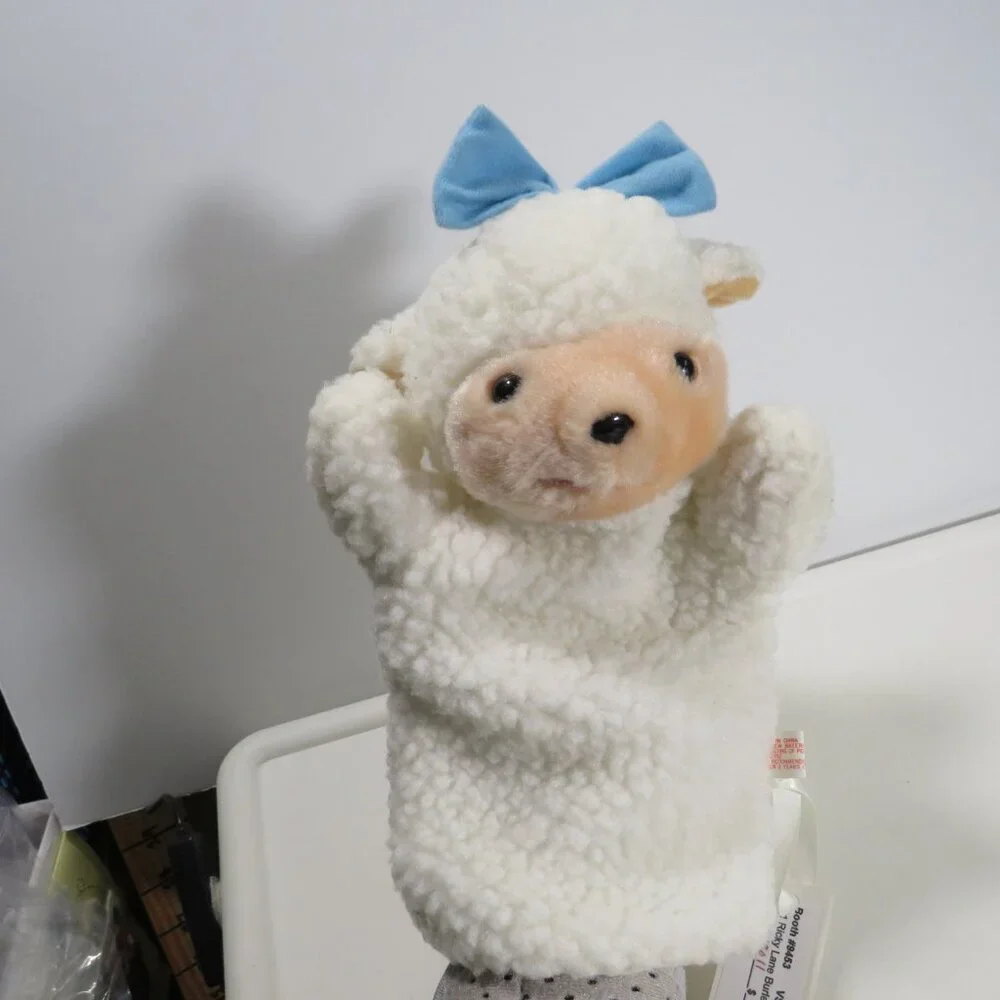 vintage sheep puppet with blue bow sewn on, lined inside thick heavy fur fabric